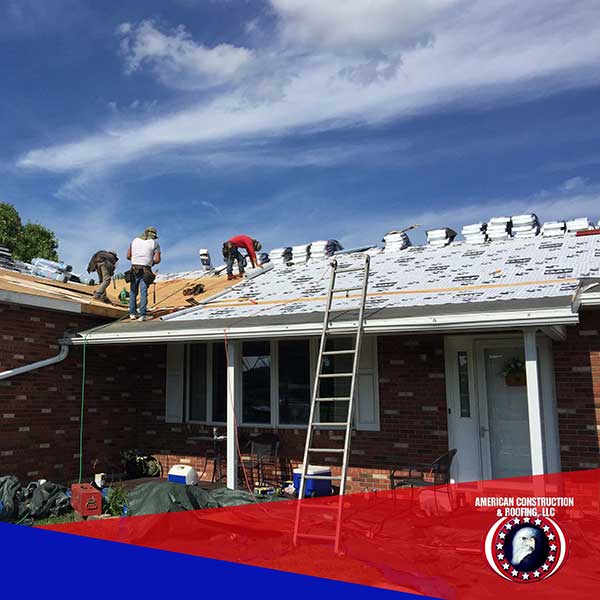 American Construction & Roofing working on a roof